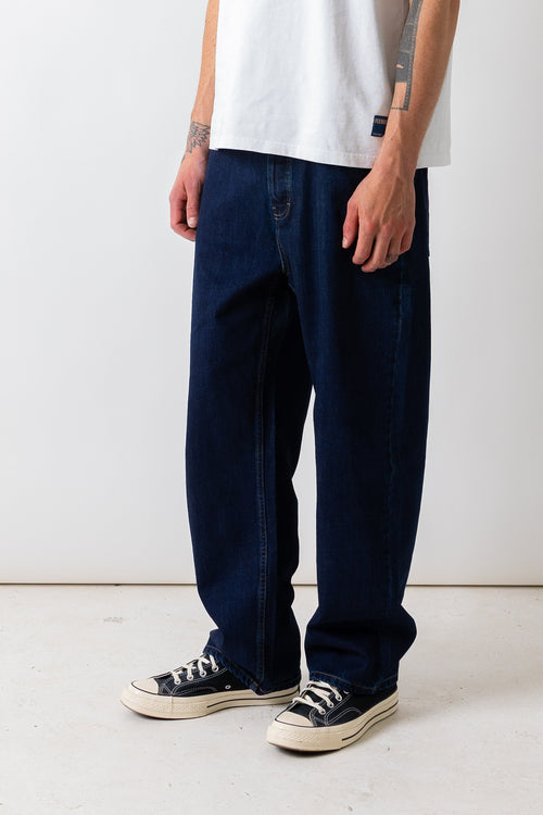 Close front view of a model wearing the Pexwear 5 Pocket Jean in Indigo.