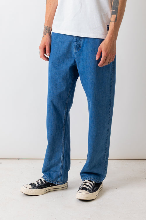 Close front view of a model wearing the Pexwear 5 Pocket Jean in Light Blue.