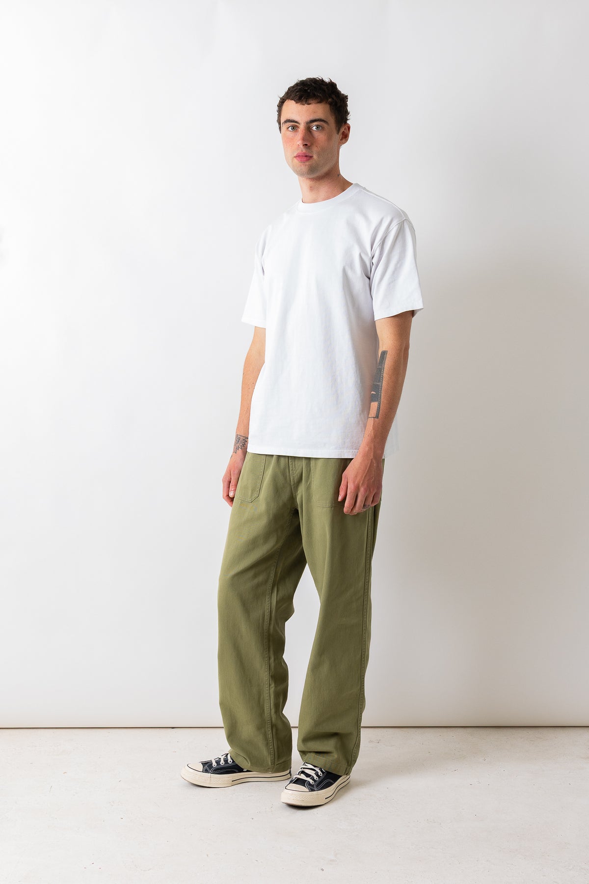 Full-length front three-quarter view of a model wearing the Pexwear Tradesman Trouser in Khaki.