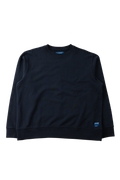 A dark navy blue crewneck sweatshirt with long sleeves, laid flat against a solid white background. A small blue tag is visible on the lower right hem.