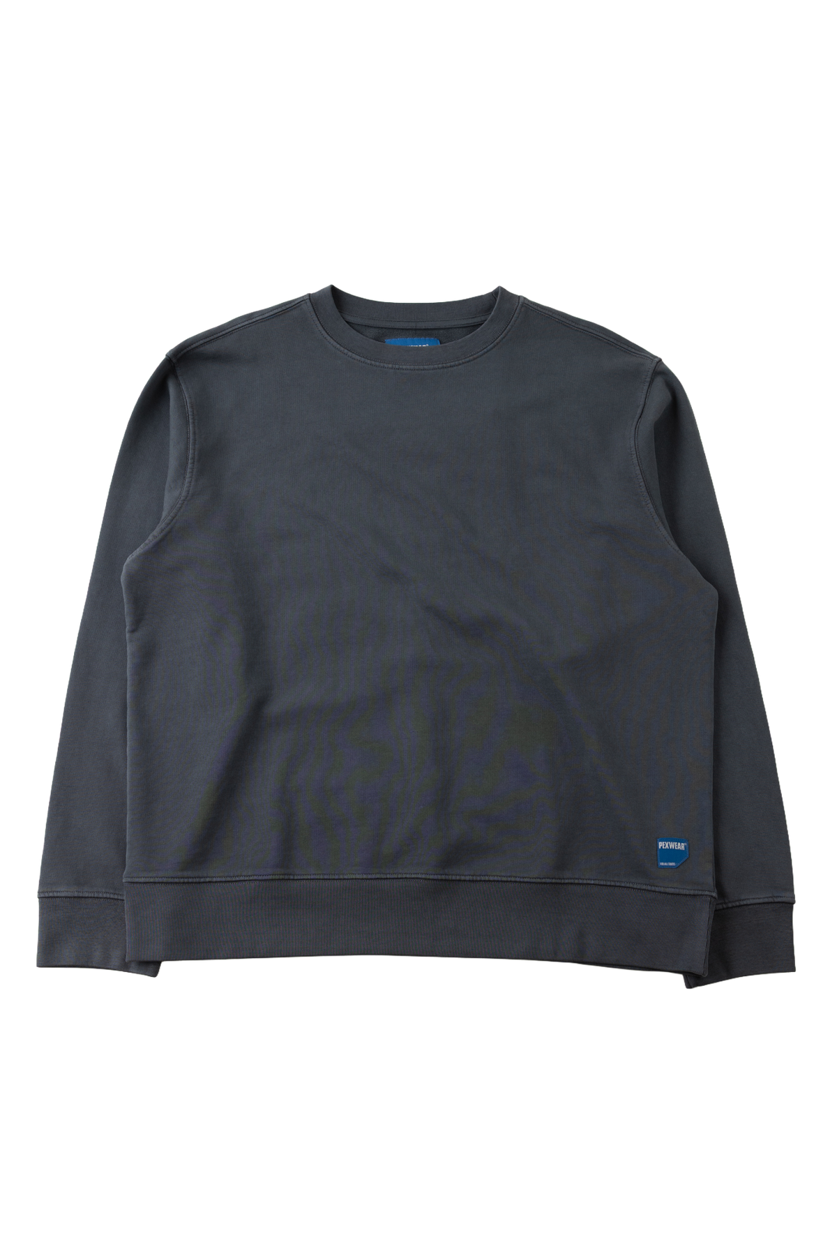 A dark charcoal gray crewneck sweatshirt with ribbed cuffs and hem, laid flat against a solid white background. A small blue tag is visible on the lower right hem.