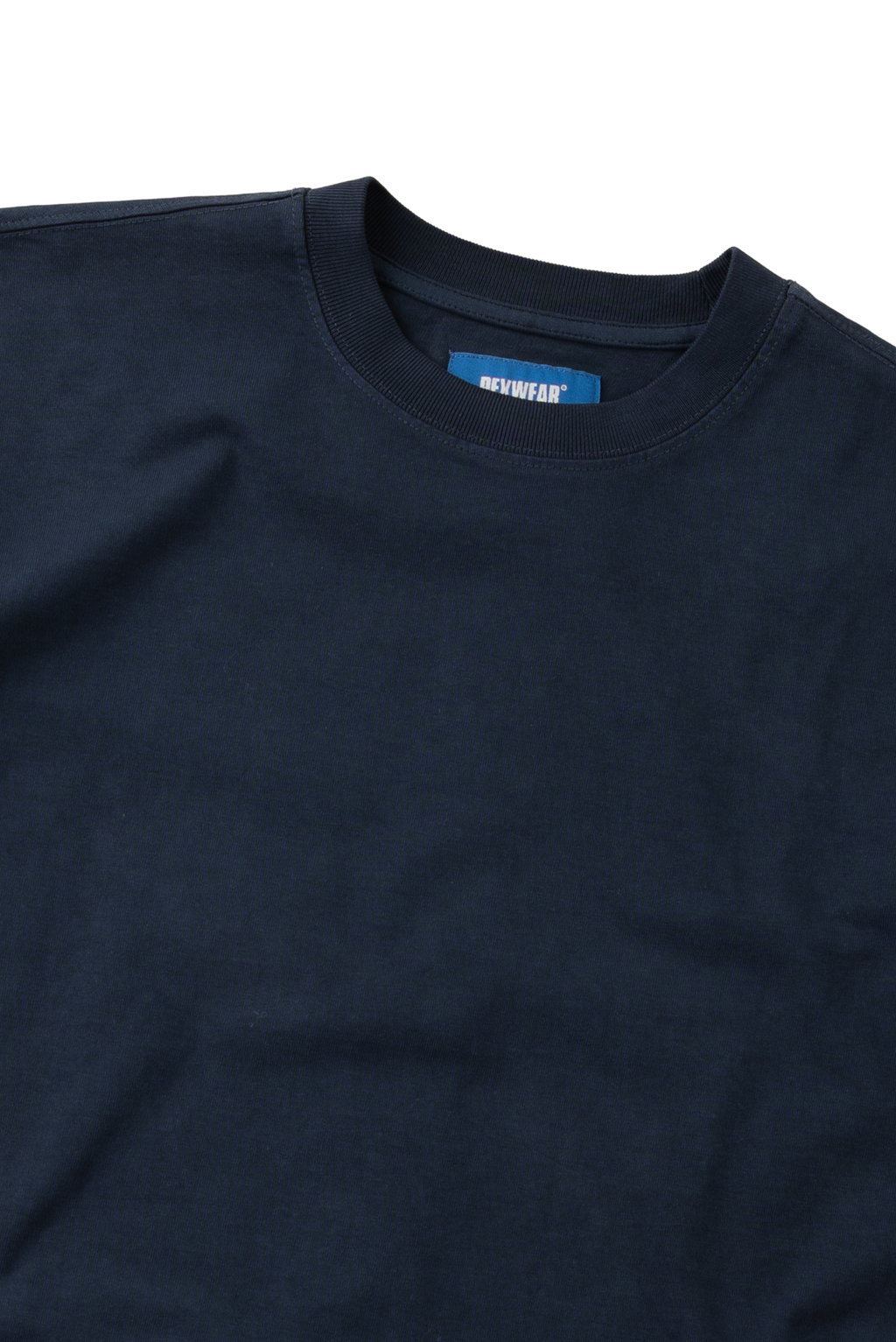 Close-up of a dark navy blue crewneck t-shirt showing the inner collar label with the brand name 'GURUWEAR'.