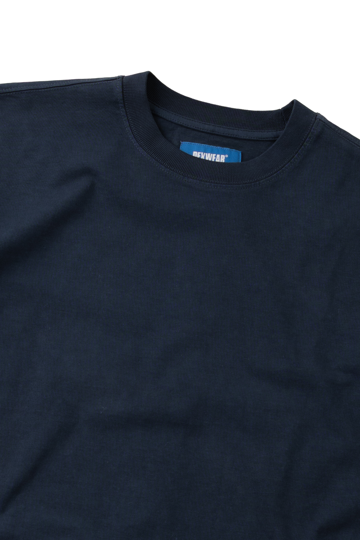 Close-up of a dark navy blue crewneck t-shirt showing the inner collar label with the brand name 'GURUWEAR'.