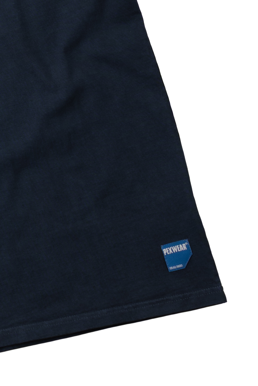 Close-up of a dark navy blue fabric garment corner with a small blue and white Perseus brand patch near the hem, set against a plain white background.