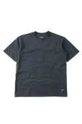 A dark charcoal gray short-sleeve crewneck t-shirt with a small blue logo patch on the bottom right hem, displayed flat against a white background.